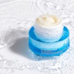 belif Moisturizing Eye Bomb 25ml - Eye cream with peptides, bakuchiol & caffeine against wrinkles & dark circles. Image image cream on water, fresh. 