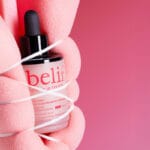 belif Super Drops Retinol & Peptide Barrier Serum 30ml - Anti-aging serum for firmer skin, refined pores & strengthened skin barrier. Image image sponge bound around product. 