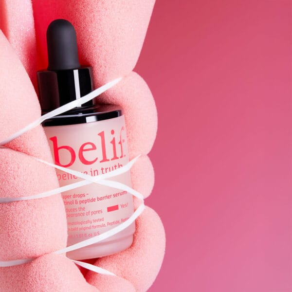 belif Super Drops Retinol & Peptide Barrier Serum 30ml - Anti-aging serum for firmer skin, refined pores & strengthened skin barrier. Image image sponge bound around product. 