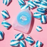 REACH POP fil dentaire menthe - fil dentaire végétalien ciré avec 384 microfils & emballage durable, 50m. Image mint candy flavor. 